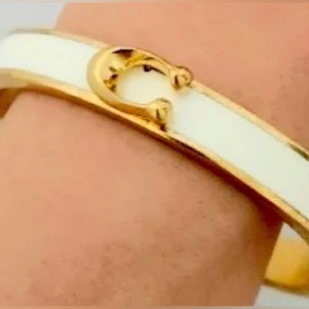 Authentic New with tag. Coach magnetic open bangle.